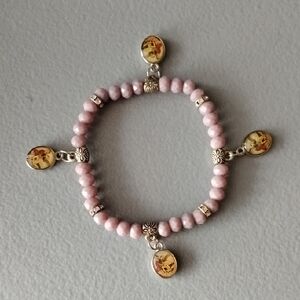 Elegant Pink Beaded Bracelet with Floral Charms
